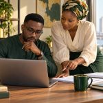 Conceptual AI-generated illustration of two adult Nigerian professionals checking an AI-assisted draft against source notes; not research participants.